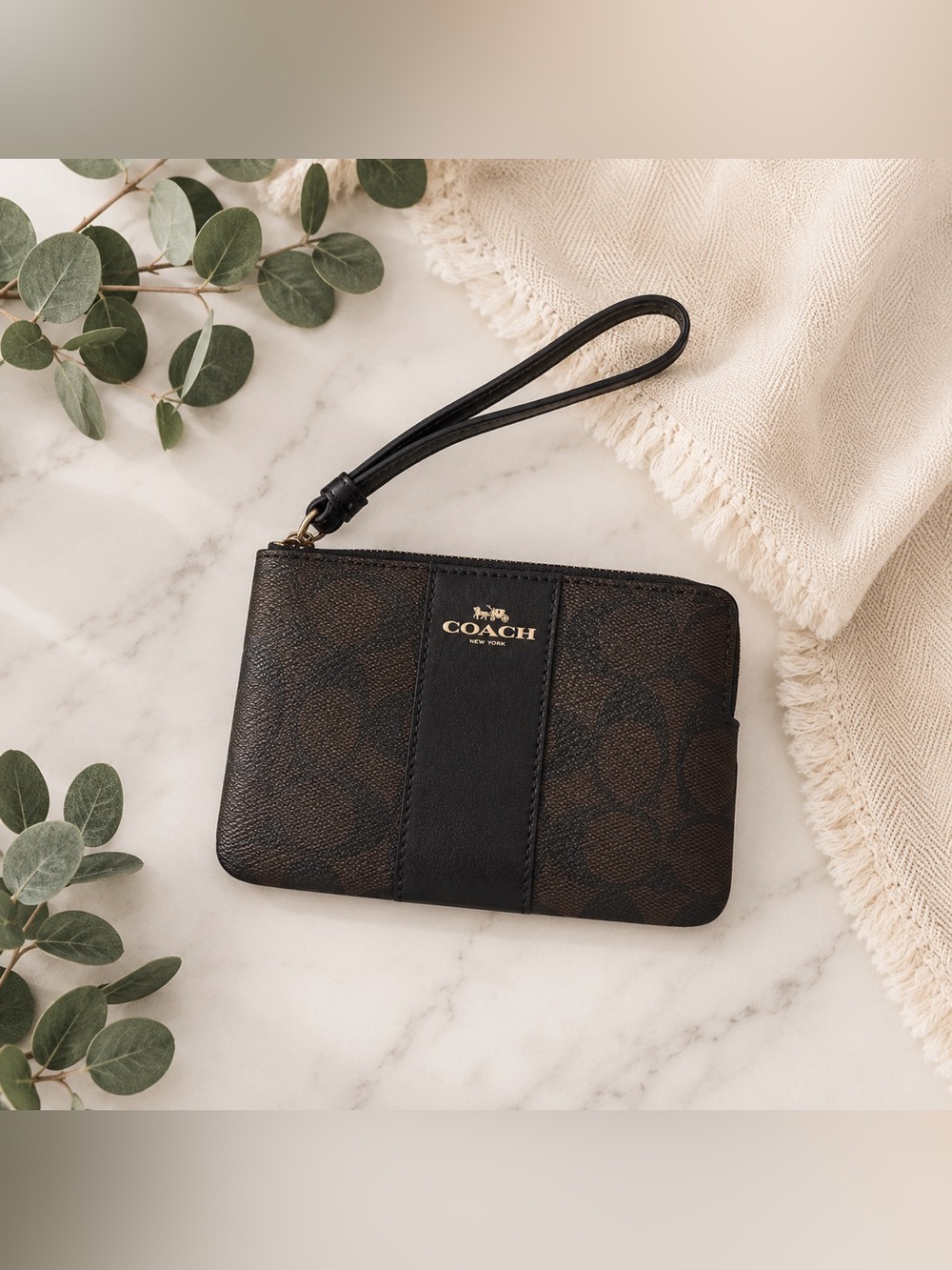 15. Coach Brown/Black Coated Leather Wristlet